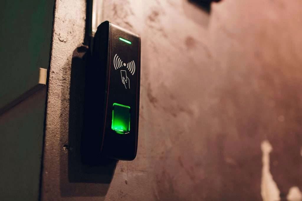 Credential reader beside an entry door